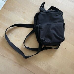 Mini Black Backpack with Adjustable Strap and Durable Fabric